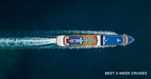 a photo of a cruise ship taken as an aerial shot, showing the back waves and deep blue sea water.