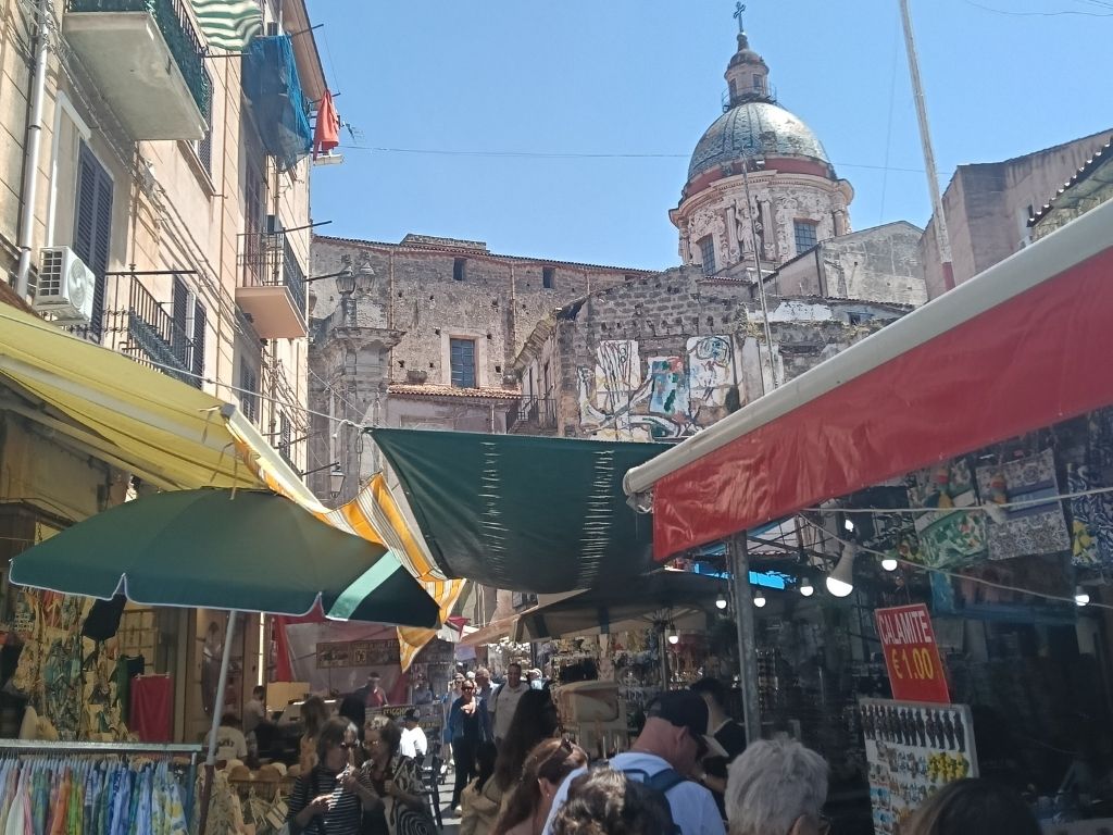 Chiesa del Carmine Maggiore - A view through the canopies of the Ballaro Street Market