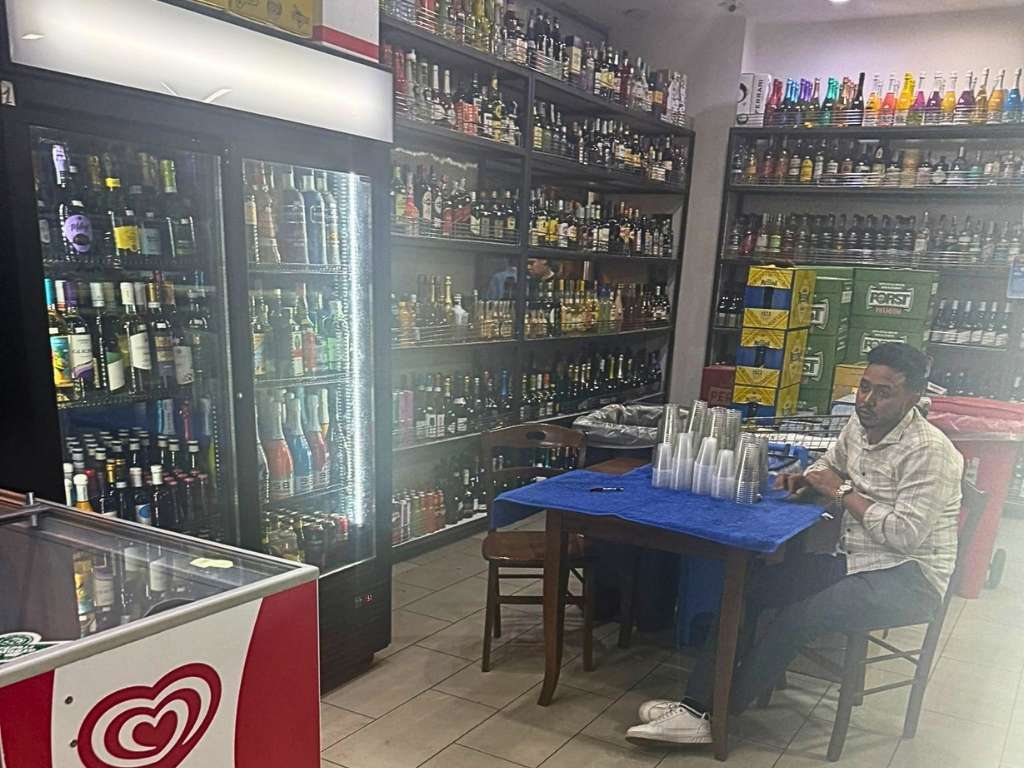 a convenience store in Palermo we saw there in our 24 hour trip where people buy beer by the cup.